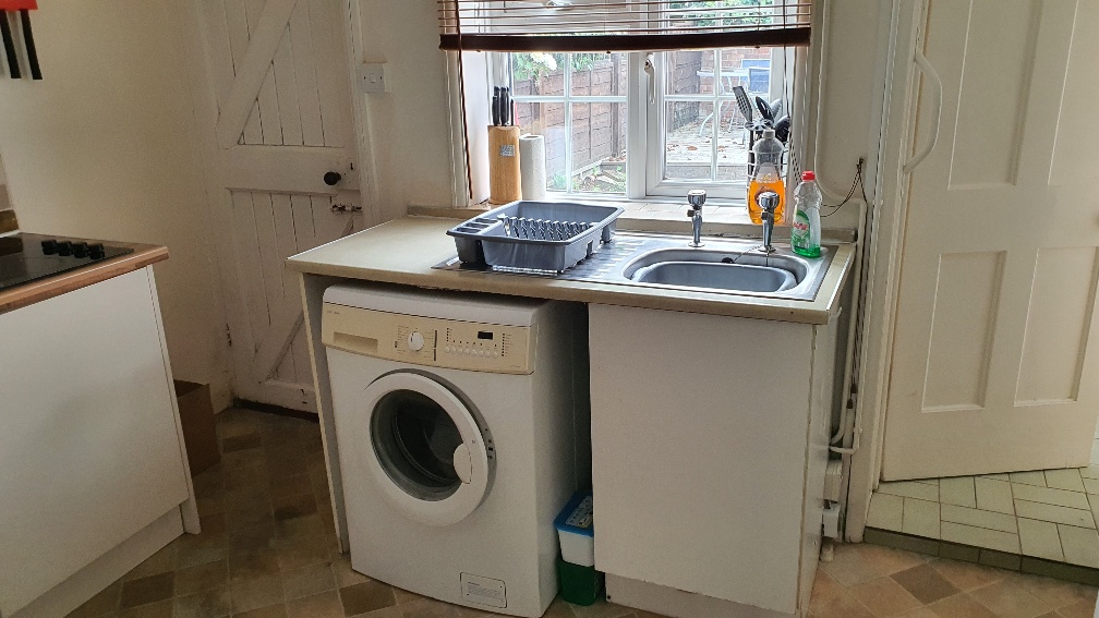 Washing machine and kitchen sink area